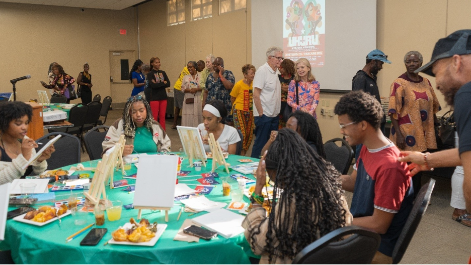 A group of people sitting around a table

AI-generated content may be incorrect.