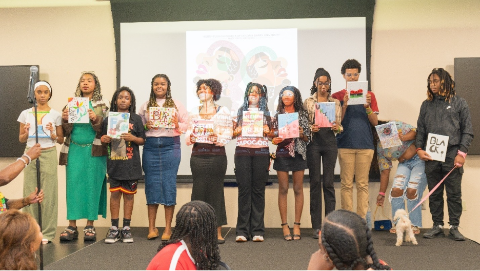 A group of people holding signs

AI-generated content may be incorrect.