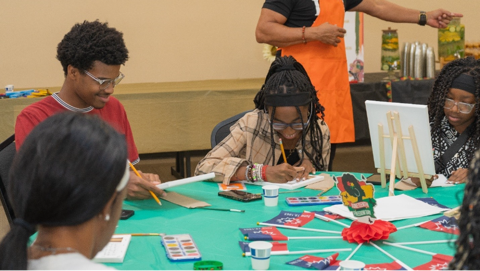 A group of people sitting at a table

AI-generated content may be incorrect.
