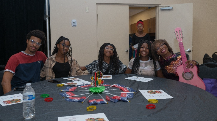A group of women sitting at a table

AI-generated content may be incorrect.