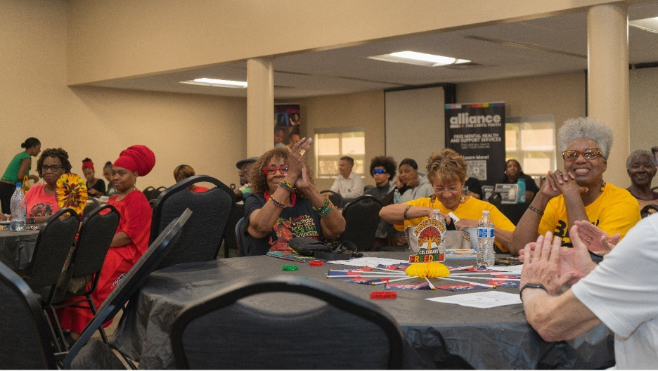 A group of people sitting at a table

AI-generated content may be incorrect.