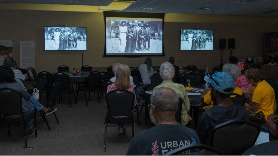 A group of people watching a screen

AI-generated content may be incorrect.