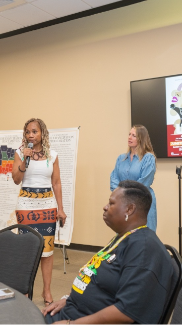 A person speaking into a microphone

AI-generated content may be incorrect.